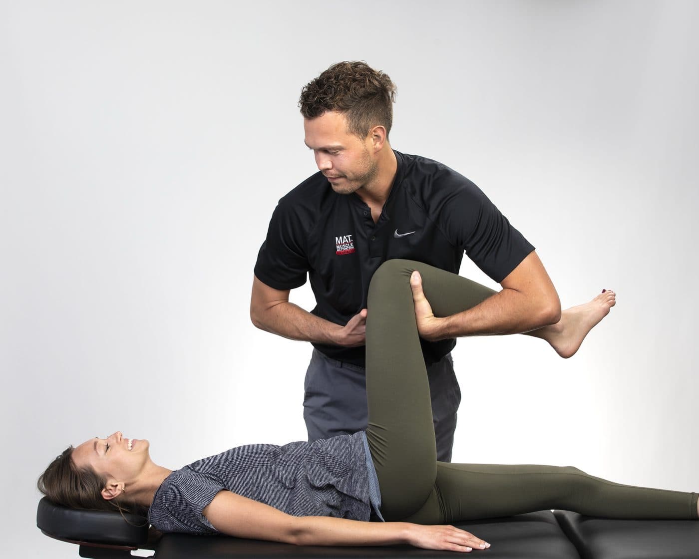 Cameron Hunt performing a lower-body assessment during a MAT session